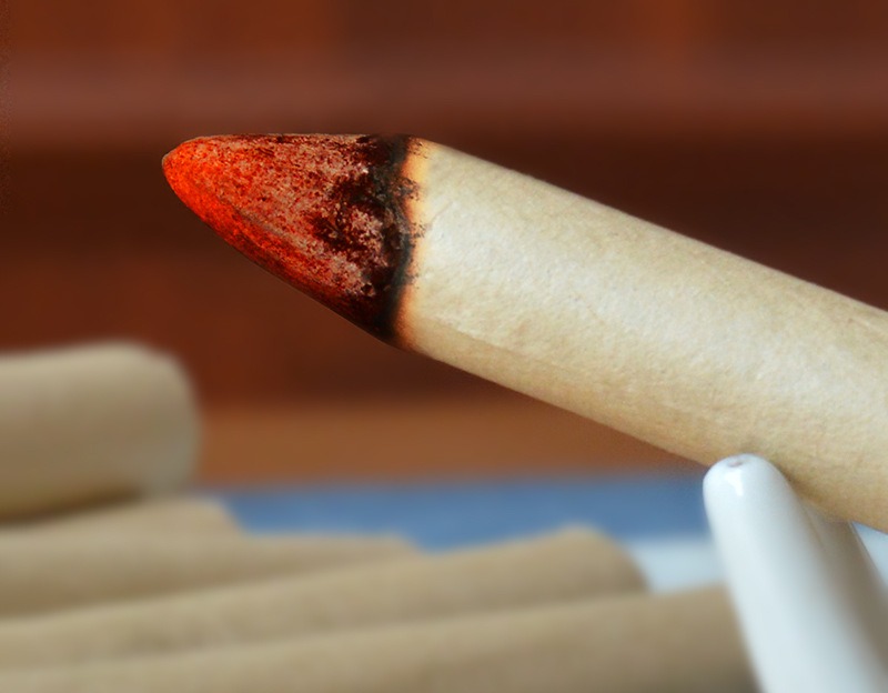 The lit end of a roll (source main photo).