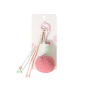 Pink mini mugwort hammer keychain on a backing card