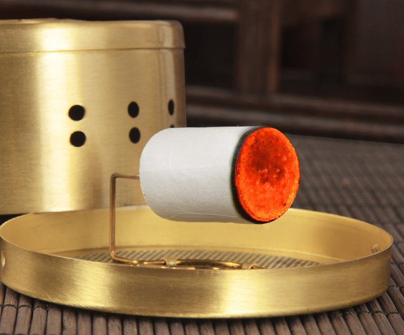 A lit cone on a moxa box holder (source main photo; holder not included).