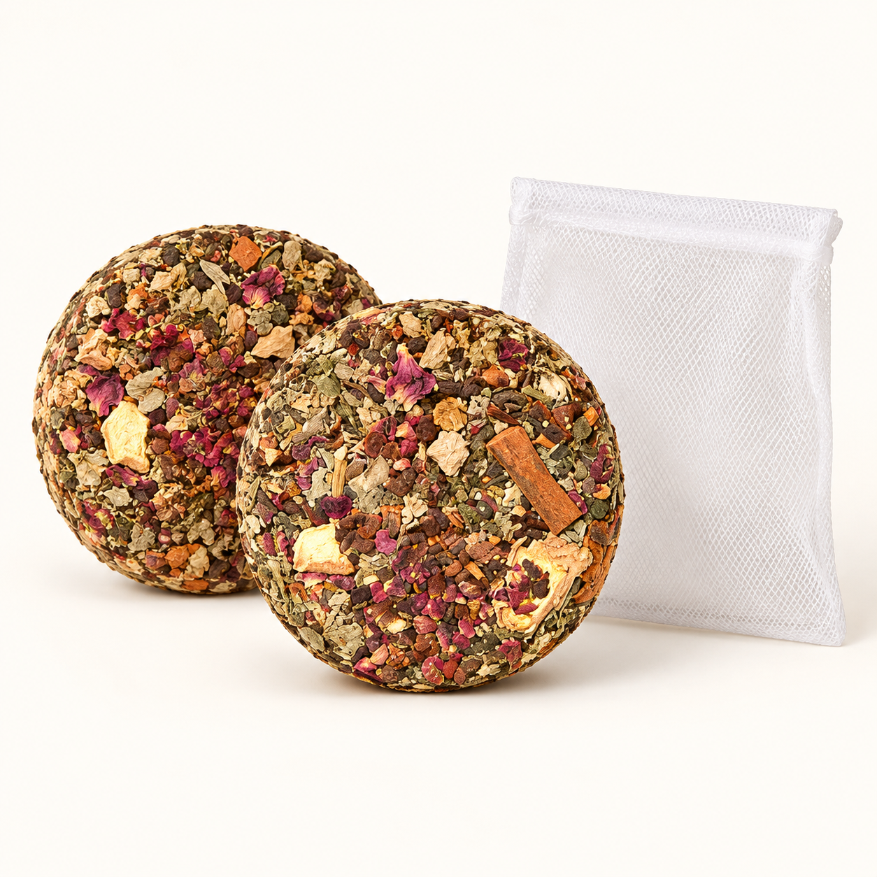 Botanical bath cakes and optional mesh pouch; source-identifying text removed.